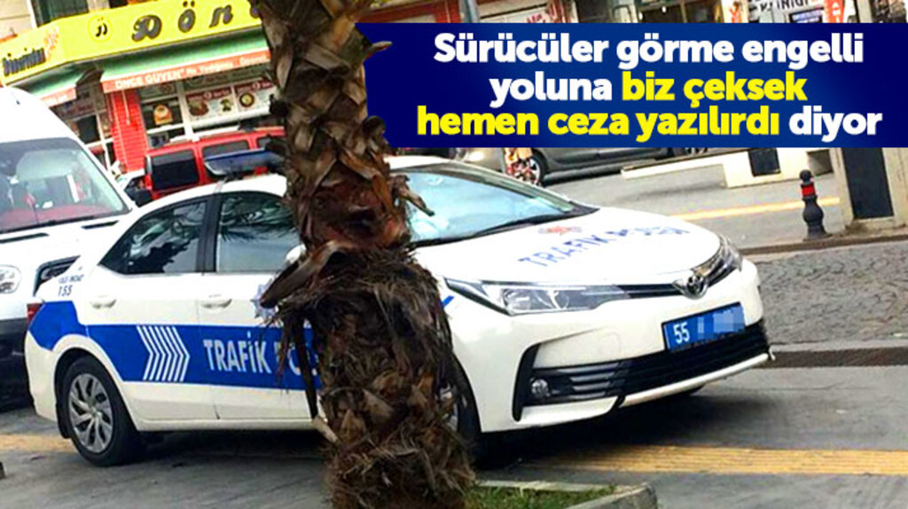 Samsun'da trafik polisi aracını görme engelliler için yapılan sarı çizgilerin üzerine park etti